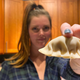 Audrey holding up birria gyoza to the camera